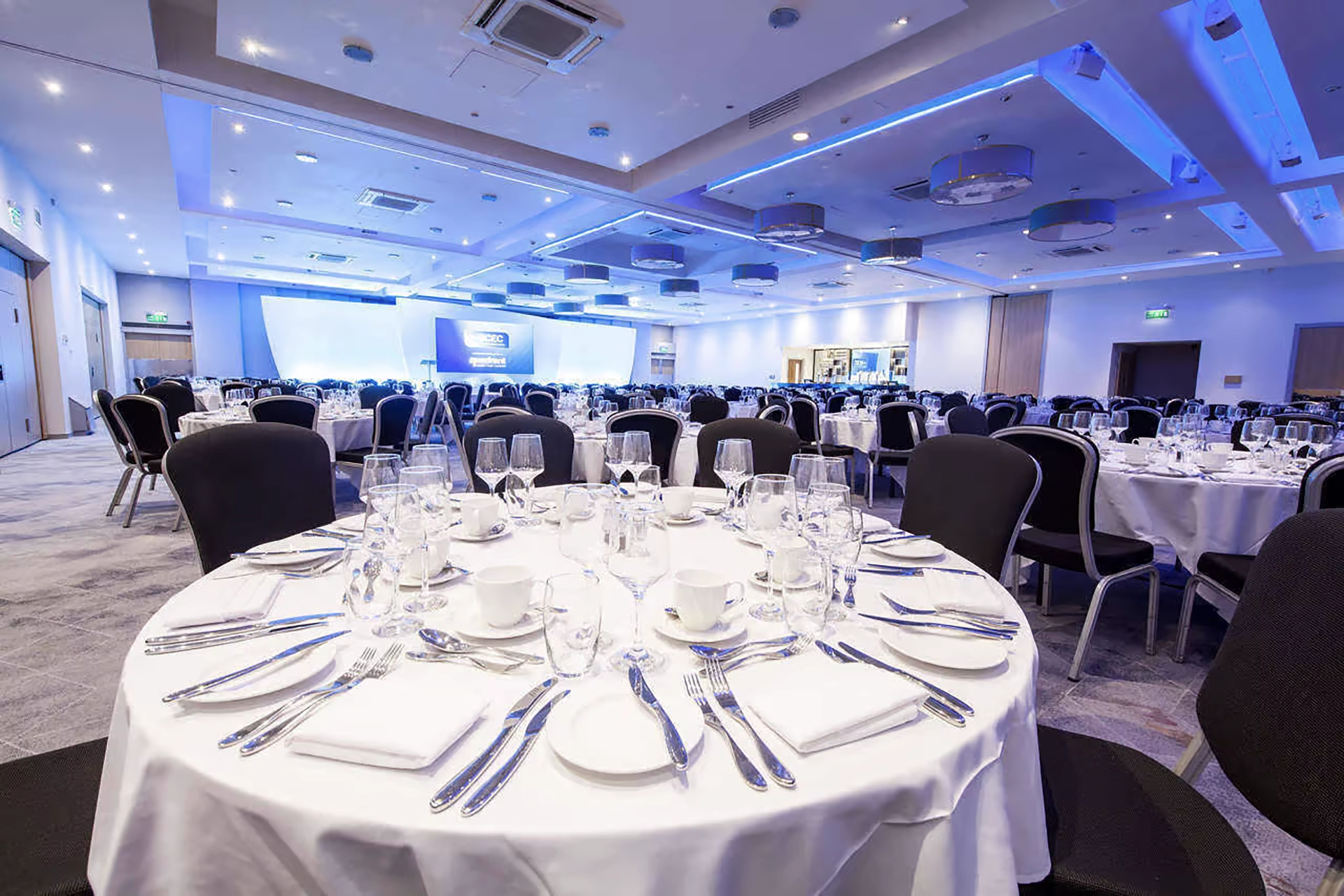 The Mercian Suite at BCEC, Birmingham, with tables laid for dinner