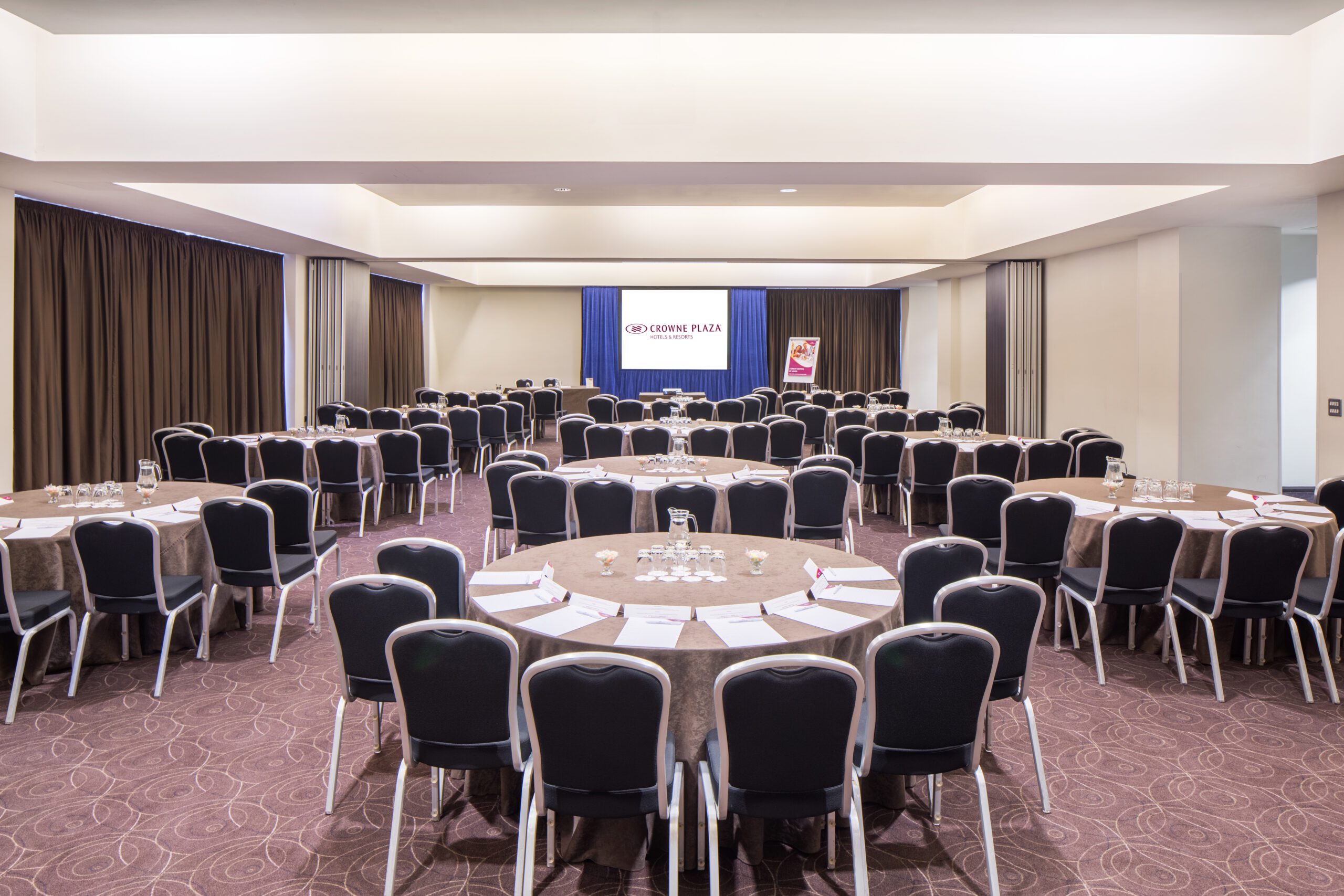The Vista Suite at the Crowne Plaza Birmingham, with tables and chairs set up in a cabaret style