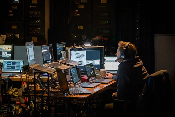 Technical production crew behind the scenes at a Quadrant event