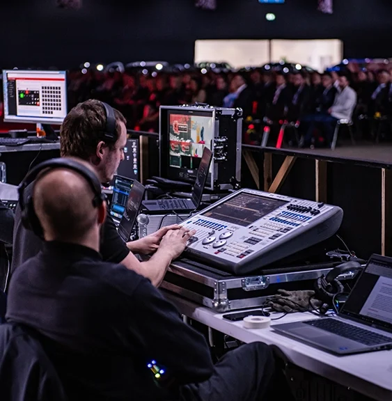Technical production crew working at the mixing desk at Sytner event in 2024